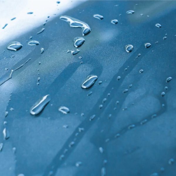Windshield coatings in USA – By TintBusiness Water running of a windshield in USA rainy weather which allows for safer driving